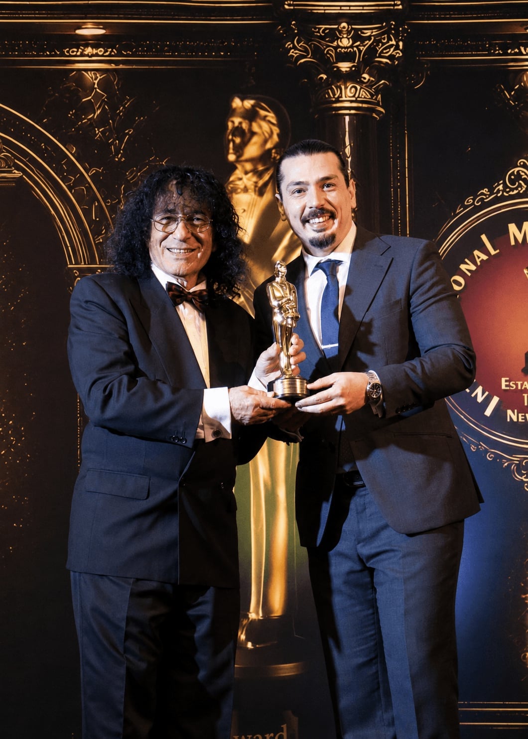 Davit Ro receiving The Merlin Award from Tony Hassini (International Magicians Society)